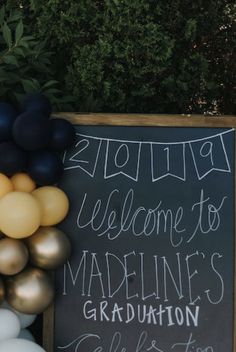 a welcome sign and balloons are on display