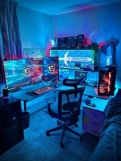 a room filled with computer monitors and gaming equipment