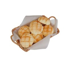 some cookies in a wicker basket on a white background