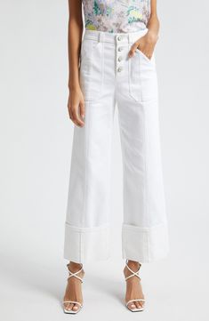 Hit refresh for white-jeans season with this wide-legged pair cut to a very cuffable length for extra trend-right style points. 28 1/2" inseam; 20 1/2" leg opening; 11" front rise; 15 1/2" back rise (size 8) Exposed-button fly Front patch pockets; back patch pockets 75% cotton, 25% polyester, 1% elastane Dry clean or machine wash, tumble dry Imported White Wide-leg Denim Jeans, White Relaxed Fit Flare Jeans, White Wide-leg Denim Pants, White Mid-rise Flare Jeans For Work, White Cropped Flare Jeans For Summer, White Relaxed Fit Cropped Flare Jeans, White Cropped Leg Flare Jeans, White Relaxed Fit Flare Jeans With Pockets, White Relaxed Fit Flare Jeans For Spring