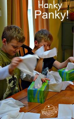 two boys sitting at a table with paper in front of them and the caption hanky panky