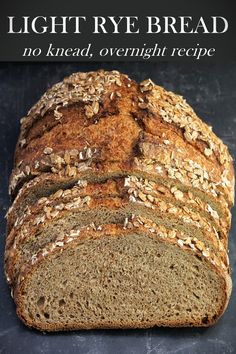 On a dark background, slices cut from a round loaf of light rye bread lean back against the rest of the uncut loaf. The top of the loaf is sprinkled with rye flakes. No Knead Artisan Bread Recipes, Bread With Rye Flour, Overnight Rye Bread, Healthy Rye Bread Recipe, Rye Flour Bread Recipe, Recipes Using Rye Flour, Bread Maker Rye Bread Recipe, Best Rye Bread Recipe, Easy Rye Bread Recipes For Beginners