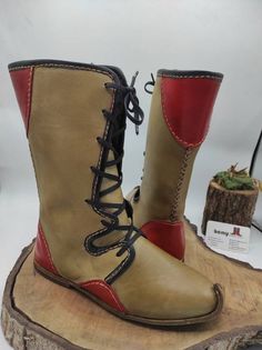 Handmade Leather Boots With Snip Toe, Festival Lace-up Leather Boots, Viking Style Leather Boots With Round Toe, Viking Leather Lace-up Boots, Viking Leather Boots With Leather Sole, Viking Style Lace-up Leather Boots, Leather Boots For Medieval Festivals, Viking Leather Boots With Rubber Sole, Leather Viking Boots With Rubber Sole