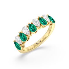 an emerald and diamond five stone ring