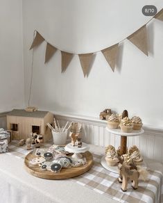 a table topped with cupcakes and other treats