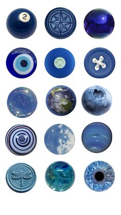 several different types of blue glass objects are shown in this image, including buttons and magnets