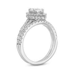 a white gold engagement ring with two rows of diamonds