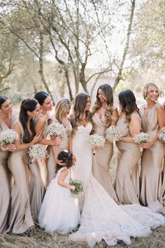 a group of bridesmaids posing for a photo