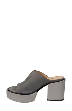 A chunky block heel elevates this chic platform mule with a soft suede strap and tailored topline delivering a modern vibe with a nostalgic twist. 3" heel; 1 1/2" platform Cushioned footbed Leather upper/synthetic lining and sole Imported Casual Suede Mules With Block Heel, Chic Suede Clogs With Stacked Heel, Suede Mules With Stacked Block Heel, Suede Chunky Platform Block Heels, Chunky Platform Suede Heels For Spring, Suede Chunky Platform Heels With Block Heel, Spring Chunky Platform Suede Heels, Spring Suede Chunky Platform Heels, Spring Suede Mules With Sculpted Heel