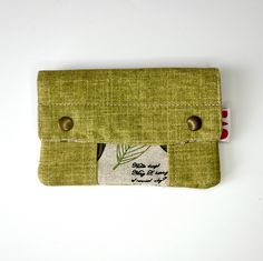 The wallet/purse is a perfect complement for your money, coins and cards that you carry every day. It has a zipper closure, allowing you to put your money and cards neatly. In addition, it has two snap buttons that give you more security. Its design is modern, timeless and functional. The colors are warm, beautiful and combinable. MEASURES: Height - 10 cm approx. Width - 15 cm approx. MATERIALS: Exterior - Durable upholstery fabric. metal snaps Interior - Printed cotton fabric. TAKE CARE OF YOUR Green Bags With Coin Pocket For Daily Use, Green Daily Use Bag With Coin Pocket, Green Bags With Coin Pocket, Green Rectangular Bag With Coin Pocket, Green Zipper Pouch Wallet For Travel, Rectangular Coin Purse With Card Slots For Daily Use, Green Travel Wallet With Zipper Pouch, Green Travel Pouch Wallet, Green Travel Wallet Pouch