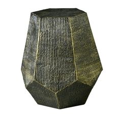 a black and gold vase sitting on top of a white surface with no one in it