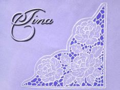 a white lace with flowers on it and the word sina written in cursive writing