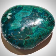 a large green rock sitting on top of a table