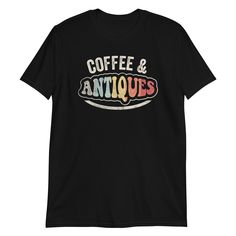 Are you an antique enthusiast with a flair for vintage fashion? The Coffee and Antiques Antique Lover Retro Vintage Style T-Shirt is the perfect addition to your wardrobe! Embrace your unique style and showcase your love for all things retro with this eye-catching tee that adds a touch of nostalgia to your everyday look. This shirt is not just a fashion statement; it offers comfort and quality that stand the test of time. Made from 100% ring-spun cotton, it provides a soft, breathable feel that Vintage Graphic Design Short Sleeve T-shirt, Retro Short Sleeve T-shirt With Graphic Design, Retro Crew Neck T-shirt With Letter Print, Retro Crew Neck T-shirt With Text Print, Vintage Graphic Print Short Sleeve T-shirt, Vintage Black T-shirt With Relaxed Fit, Black Relaxed Fit Vintage T-shirt, Retro Short Sleeve T-shirt With Vintage Print, Vintage Short Sleeve Tops With Text Print