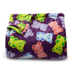 a purple and green teddy bear print blanket