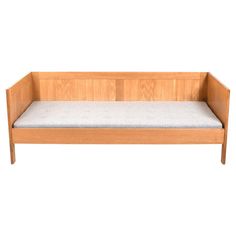 a wooden bench with a cushion on it