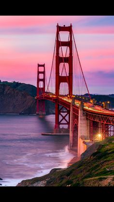 the golden gate bridge in san francisco, california at sunset with waves crashing against it