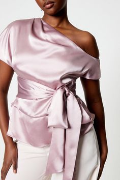 Asymmetrical one-shoulder design for a striking silhouette Luxurious satin fabric with a lustrous sheen Elegant draping detail across the bodice Flattering tie-side feature accentuates the waist Versatile peplum hem adds a feminine touch Embrace sophistication with this exquisite tie-side drape satin top from Coast. Perfect for those special occasions that demand a touch of elegance, this top combines contemporary design with timeless charm. The asymmetrical one-shoulder neckline creates a bold statement, while the sumptuous satin fabric catches the light beautifully as you move. The artful draping across the bodice adds dimension and interest, complemented by the adjustable tie-side that allows for a customised fit. Style this versatile piece with tailored wide-leg trousers and strappy Occasion Dresses Wedding Guest, Petite Jumpsuit, Petite Coat, Tall Clothing, Peplum Hem, Tshirt Skirt, Satin Top, Petite Tops, Petite Outfits