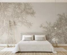 a bedroom with a large wall mural behind the bed