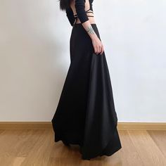 Explore our Gothic Punk Layered Maxi Skirt for a touch of opulence. Featuring a double layer design, eyelet lace-up detail, and high-waisted style, this skirt radiates sophistication and mystery. The baggy fit and ankle length enhance its luxurious charm. Available in timeless black, made from a premium blend of polyester and spandex for comfort and style. Elevate your wardrobe with this exquisite piece that exudes elegance and allure. Double layer design Eyelet lace-up detail High-waisted style Edgy Pleated Skirt For Alternative Fashion, Fitted Alternative Style Mini Skirt For Spring, Fitted Mini Skirt For Spring In Alternative Style, Gothic Tiered Skirt For Summer, Black Skirt For Costume Party In Spring, Black Skirt For Spring Costume Party, Spring Costume Party Skirt, Fitted Alternative Style Skirt For Summer, Fitted Alternative Skirt For Summer