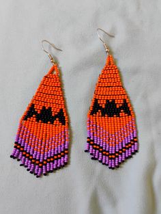 the beaded earrings are orange and purple