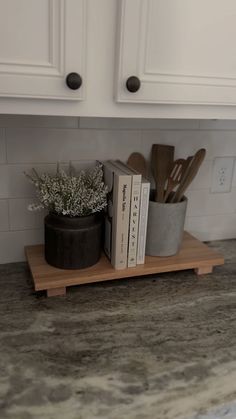 the kitchen counter is clean and ready to be used as a cook's utensil holder