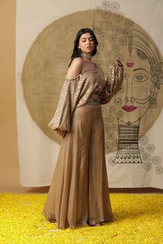 featuring golden one shoulder palazzo set. Comes with gorgette hand embroidered blouse. Fabric : COTTGN BROWN Color FIT FITTED Lining Material crepe 15 days Delivery 2 Components Evening Party Wear Georgette Palazzo Set, Glamorous Embroidered Georgette Set, Glamorous Georgette Palazzo Set For Eid, Gold Palazzo Set For Festive Party, Festive Gold Palazzo Set For Party Wear, Gold Festive Party Wear Palazzo Set, Party Sharara With Gold Embroidery, Georgette Pant Set For Party, Glamorous Georgette Palazzo Set For Festive Season