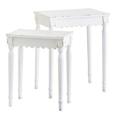 two white wooden tables sitting next to each other