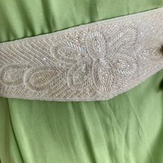 Vintage beaded belt in beige shade. A beautiful accent for a wedding dress, or party outfit. Fits waist 27-28" Elegant Cream Sashes For Formal Occasions, Elegant Adjustable Embroidered Belt, Elegant Embellished Sashes, Elegant Embroidered Belt For Formal Occasions, Beaded White Bridal Belt For Party, White Beaded Bridal Belt For Party, Elegant Evening Bridal Belt With Embroidery, Elegant Beaded Sashes For Wedding, Elegant Embellished Sashes For Party