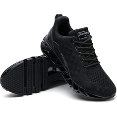 a pair of black running shoes on top of each other's soles,