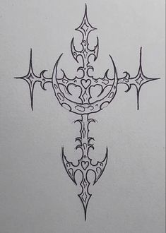 a cross tattoo on the side of a white paper with an intricate design in black ink