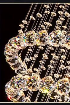 a chandelier with many crystal balls hanging from it's centerpieces