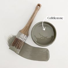 a paint brush next to a container with the words cobblestone on it