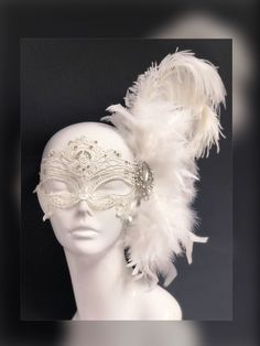 Off-white feather mask with gorgeous crystal on silver brooch embellishment, perfect for your all-white theme Masquerade Ball or Diner en Blanc! The mask pictured comes with 40 rhinestones on the lace mask. You have the option to purchase the mask without rhinestones with feathers & brooch only as well! Thank you for supporting small businesses and hope our products bring you and loved ones some joy and humor in these trying times. S H I P P I N G - Current processing times range 5-7 days. P Angel Masquerade Mask, Dove Mask Masquerade, White Masquerade Mask Men, Masquarede Ball Masks, Bridgerton Masquerade, White Lace Mask, Masquerade Aesthetic, Face Mask Masquerade, White Masquerade Mask