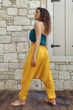 Meet our Tribal Gauze Cotton Harem Pants, a must-have addition to your wardrobe for their impeccable craftsmanship and attention to detail. These pants are expertly crafted using high-quality organic gauze cotton fabric, ensuring a lightweight, breathable, and remarkably comfortable fit. Baggy fit and dropped crotch provide freedom to move while offering a trendy and stylish look for any occasion. We offer a variety of size options including plus, big and tall. HOW TO STYLE THESE PANTS?Match the Yellow Loose Harem Pants For Spring, Yellow Baggy Ankle-length Bottoms, Yellow Baggy Pants For Summer, Yellow Baggy Summer Pants, Baggy Yellow Pants For Summer, Yellow Ankle-length Harem Pants With Pockets, Yellow Ankle-length Harem Pants, Yellow Harem Pants With Pockets, Casual Baggy Yellow Harem Pants