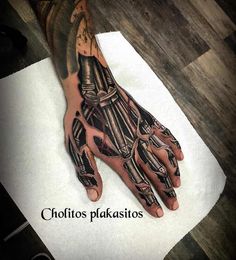 a man's hand with tattoos on it and the words chottoos plaksios