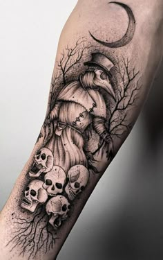 a man's arm with skulls and a clock on it, as well as the moon