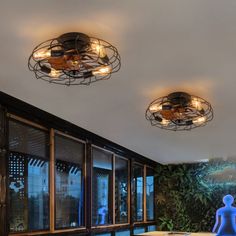 three circular lights are hanging from the ceiling