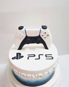 a birthday cake with a video game controller on top