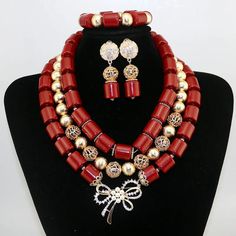 Elevate your Nigerian wedding or party look with this Bead Jewelry. Handcrafted with care, these jewelry pieces add a touch of color and cultural significance to your ensemble, making you stand out with traditional elegance. Festive Red Beaded Jewelry Set, Festive Gold Jewelry Sets With Colorful Beads, Traditional Beaded Jewelry For Ceremonies, Elegant Red Decorative Jewelry, Adjustable Beaded Bridal Necklace For Festive Occasions, Bohemian Large Beads For Wedding, Traditional Adjustable Red Jewelry Sets, Traditional Red Jewelry With Polished Beads, Traditional Gold Beaded Necklaces For Wedding