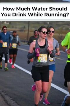 a woman running in a marathon with the caption how much water should you drink while running?