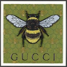 a yellow and black bee with the word gucci on it's back side