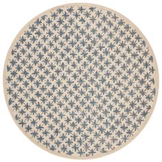 a white and blue rug with stars in the center on a white background for use as a floor mat