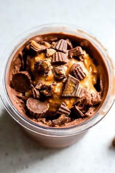 a dessert in a glass with chocolate and caramel topping