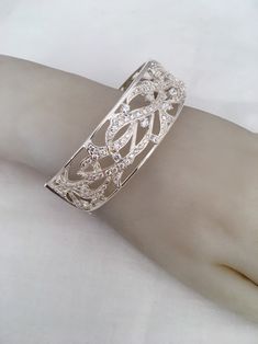 "Amazing Branch Wave Openwork Wide Hinged Bangle Beacelet Front Design Has Cubic Zirconia Stones 925 Sterling Silver Weighs 55 Grams Outside length 2.87\" x 2.38\" Width - 0.87\" New old stock Beautiful new bracelet Visit our shops on Etsy HauteCoutureLaLa TrendsCouture BeautifulPatina LastingTrends Combine shipping within first three shops listedFree Shipping on orders over $35.00 however if there is a return buyer to refund seller for the free shipping cost to seller. BeautifulPatinaFree shipp Silver Cuff Bracelet With Diamond Accents As Gift, Silver Cubic Zirconia Cuff Bracelet, Silver Cuff Bracelet With Diamond Accents, Adjustable Silver Diamond Cuff Bracelet, Silver Diamond Cuff Bracelet As Gift, Elegant Silver Cuff Bracelet With Hand Set Details, Elegant Sterling Silver Cuff Bracelet For Party, Silver Elegant Cuff Bracelet With Diamond Accents, Silver Cubic Zirconia Cuff Bracelet For Anniversary