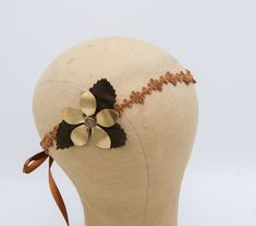 Hippie Bohemian Tie Headband of Camel Suede Trim, brown Leaves and a large metal daisy, Boho Festival Fashion This headband has a suede trim, with brown ribbon ties. to one side I added brown suede fabric leaves, and a large brass metal daisy with a bead center. The metal flower measures about 2.24 inches across. Perfect for that Music Festival bohemian vibe. This would be fun for a hippy costume, 70's party or just for fun.  PLEASE NOTE the ribbon ties in the back will be more the color of the Adjustable Gold Headband For Summer, Brown Adjustable Handmade Headband, Adjustable Brown Headband As Gift, Adjustable Brown Headband For Gift, Adjustable Brown Headband As A Gift, Adjustable Brown Headband Gift, Hippy Costume, 70's Party, Fabric Leaves