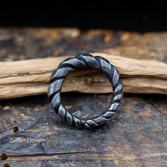 Black, twisted iron ring perfect gift for a man, boyfriend or husband. Made using traditional blacksmithing techniques of fire, hammer and anvil. Surface texture is achieved through different shaped hammers and hand held chisels and profiling tools. The ring sealed with a clear wax for protection. US size - 11.5 Width - from 3.5mm up to 6.5mm This original handiwork can become an exclusive, nice piece of your style. Presented in a gift bag. European & International orders are sent by Standard po Norse Ring, Iron Anniversary Gifts, Unique Mens Rings, Iron Jewelry, Anniversary Gift For Husband, Iron Ring, Ring Hand, Anniversary Gifts For Husband, Gift For Husband