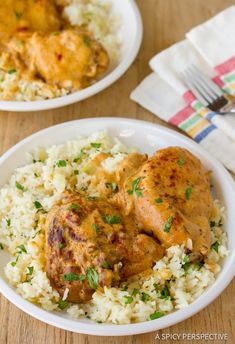 two white plates filled with rice and chicken