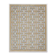 a white and beige tile with an intricate design on the bottom, it is made out of