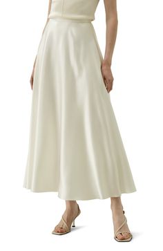 This exquisite 100% silk flowy maxi skirt is a testament to refined style and elegance. The sway of the fabric is mesmerizing, gracefully moving with your every step. The fluid sheen of the silk reflects light in a delicate, captivating manner. 100% silk Flowy maxi skirt Sway to mesmerize White skirt offers extra inner layer Fluid Sheen Maxi Silk Skirt, Hankerchief Skirt, Lily Silk, Outfits Sommer, Flowy Maxi Skirt, Silk Pajamas Women, Flowy Maxi Skirts, Silk Maxi Skirt, Camisole Set